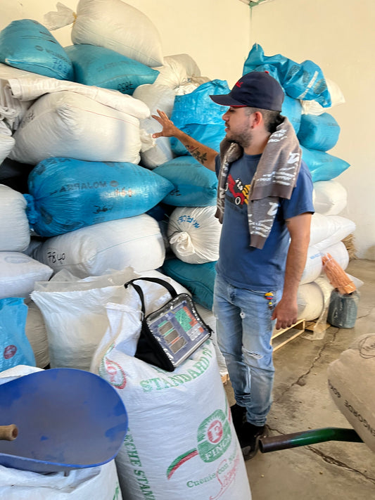 Parchment coffee stacks up at the buying stations before being shipped to the dry mill. 