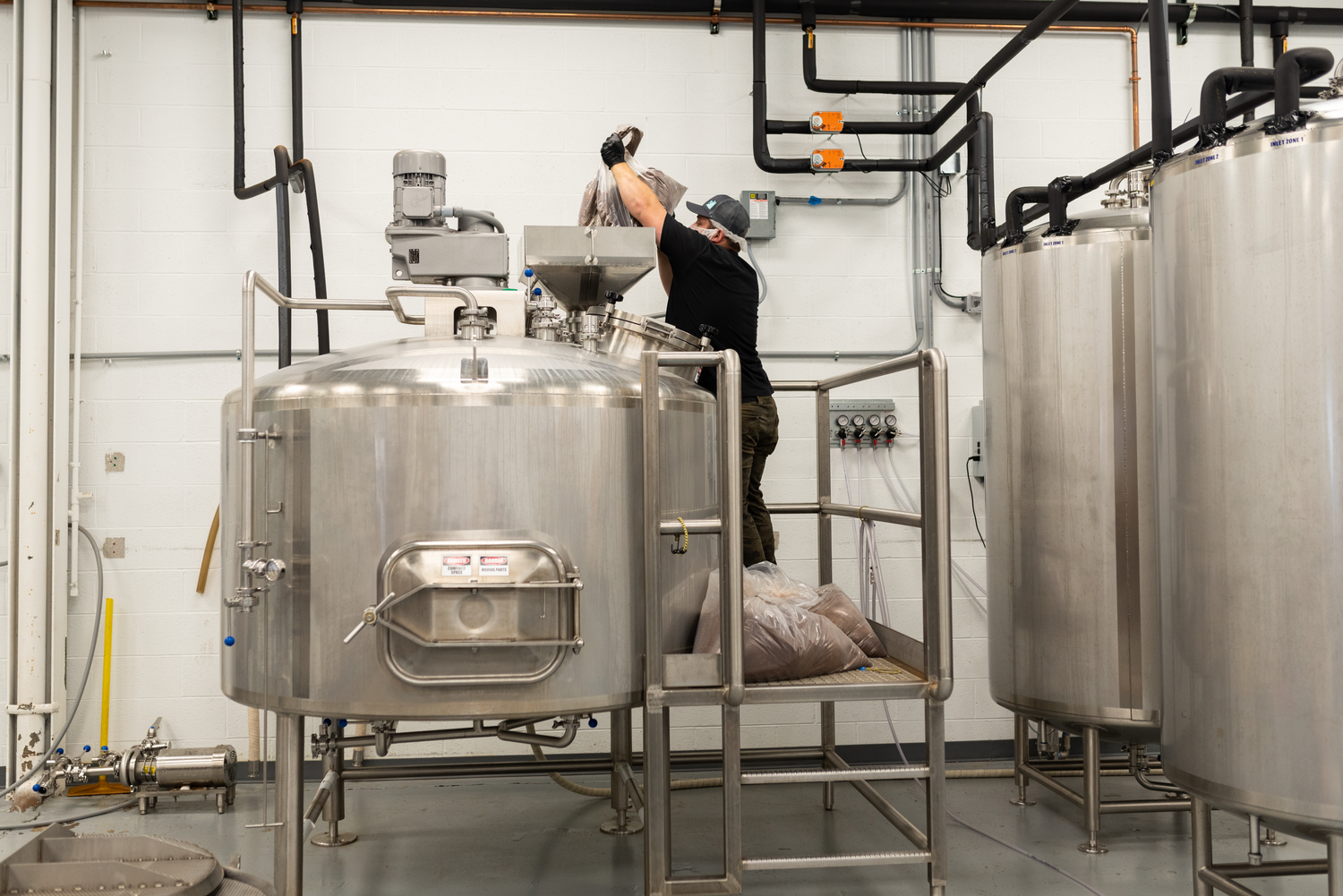 Image of man brewing cold brew coffee.