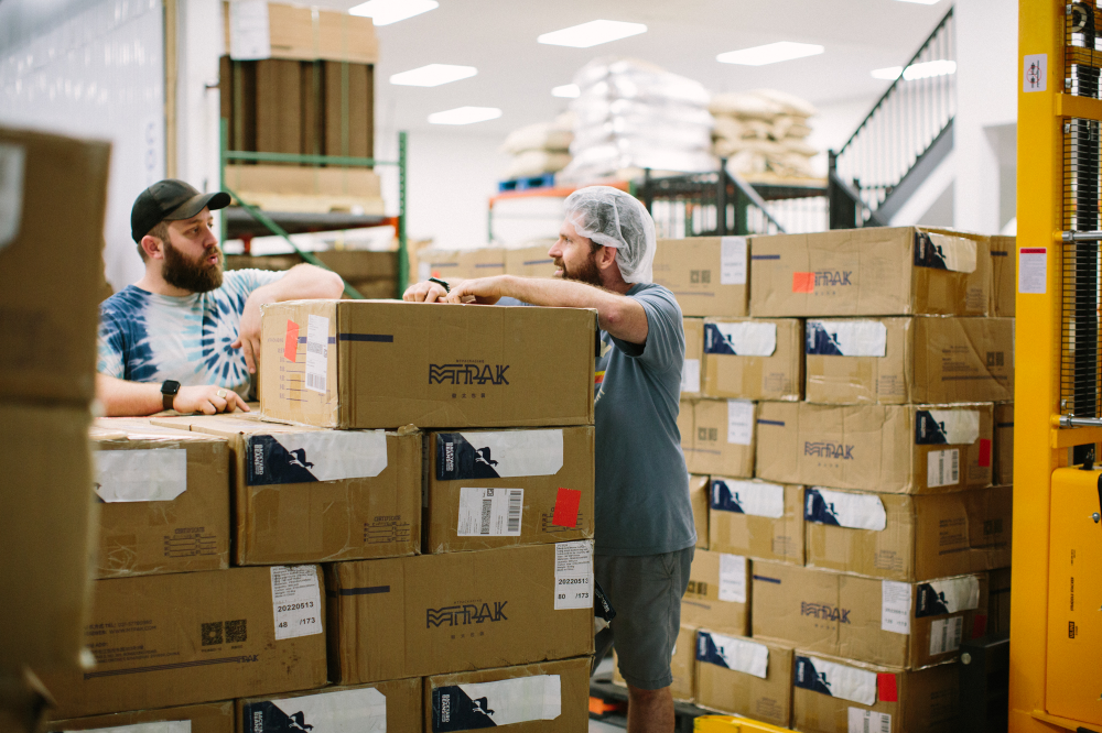 Image of employees in the Backyard Beans warehouse.