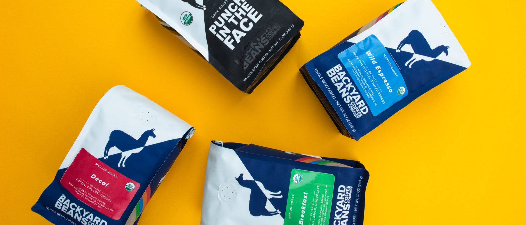 an image of assorted backyard beans coffee bags on a yellow background