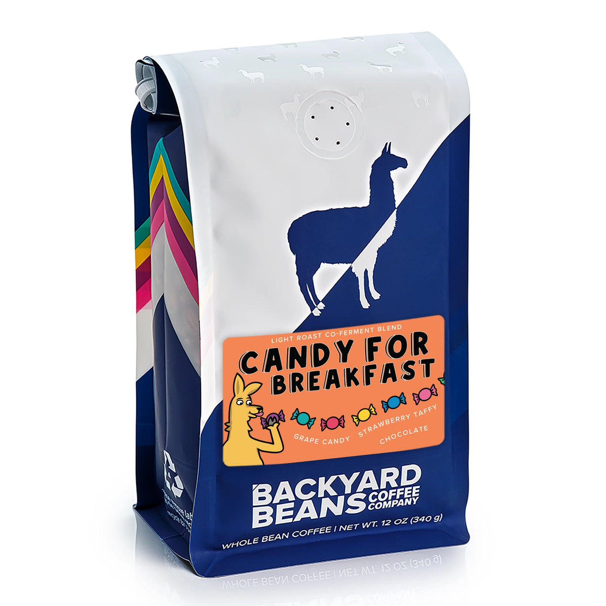 A 12 oz bag of Backyard Beans Coffee Company's 'Candy for Breakfast' whole bean coffee. The packaging features a white top section with a blue llama silhouette, a central orange label with cartoon candy illustrations, and a dark blue lower section with white text.