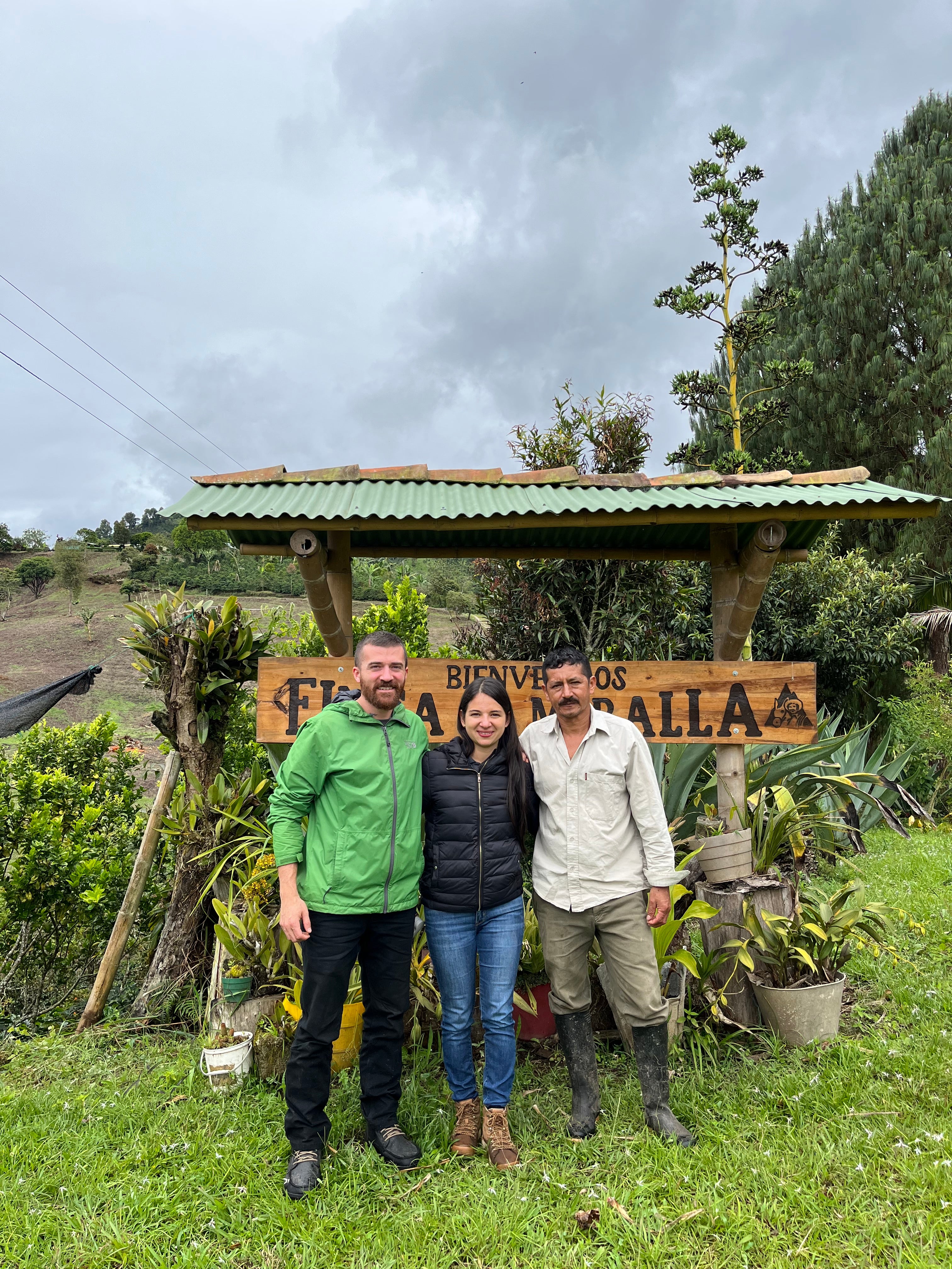 Image of three people in Huila, Colombia with the Coffee Quest