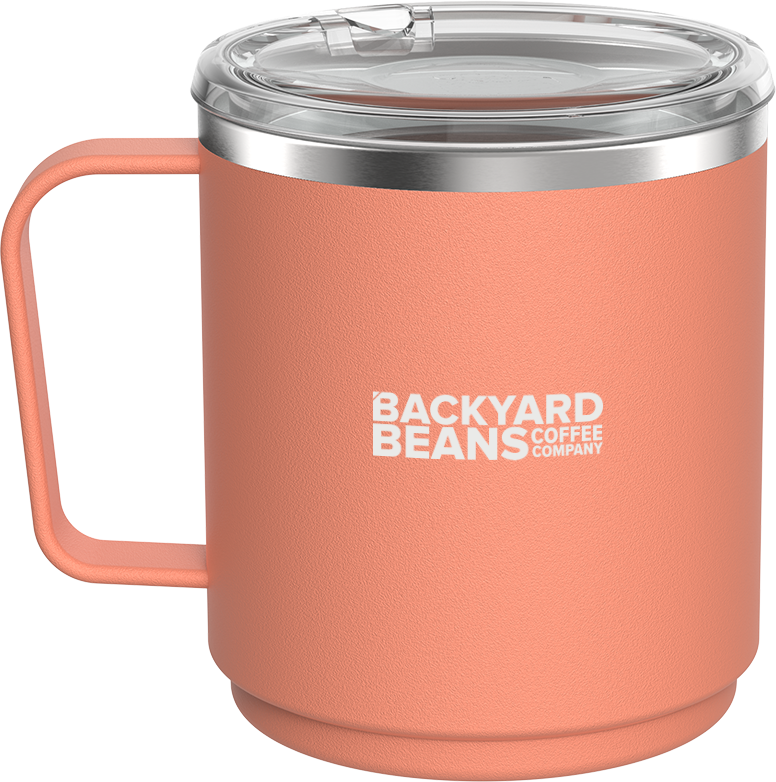 Coral mug with handle and clear lid on white background