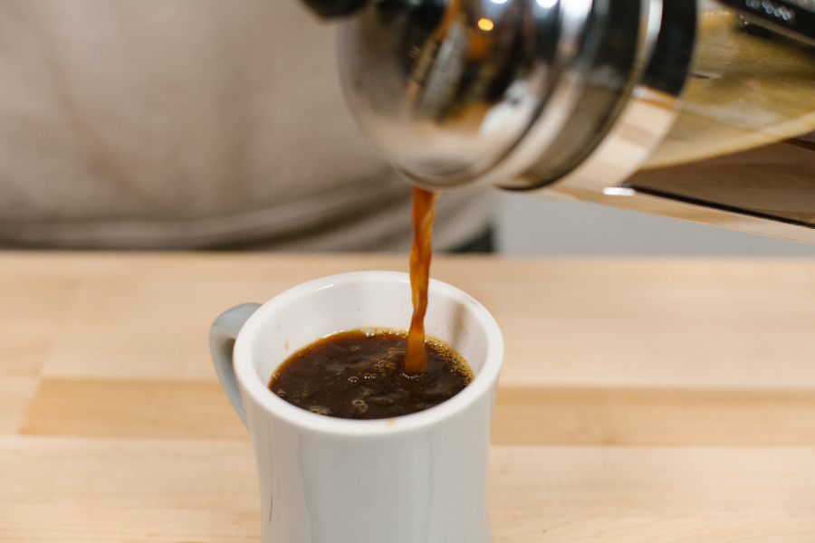 Image of French Press pouring into coffee mug.