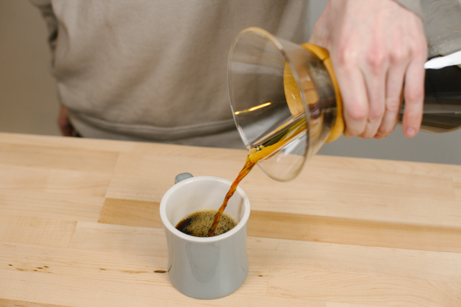 Image of Chemex pouring into coffee cup.
