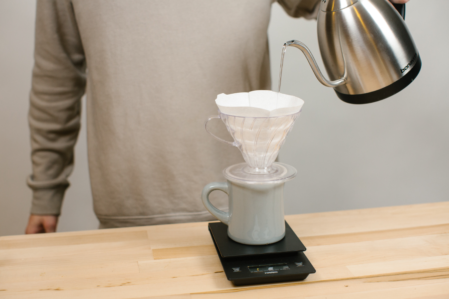 Image of pour over paper filter with water pour.