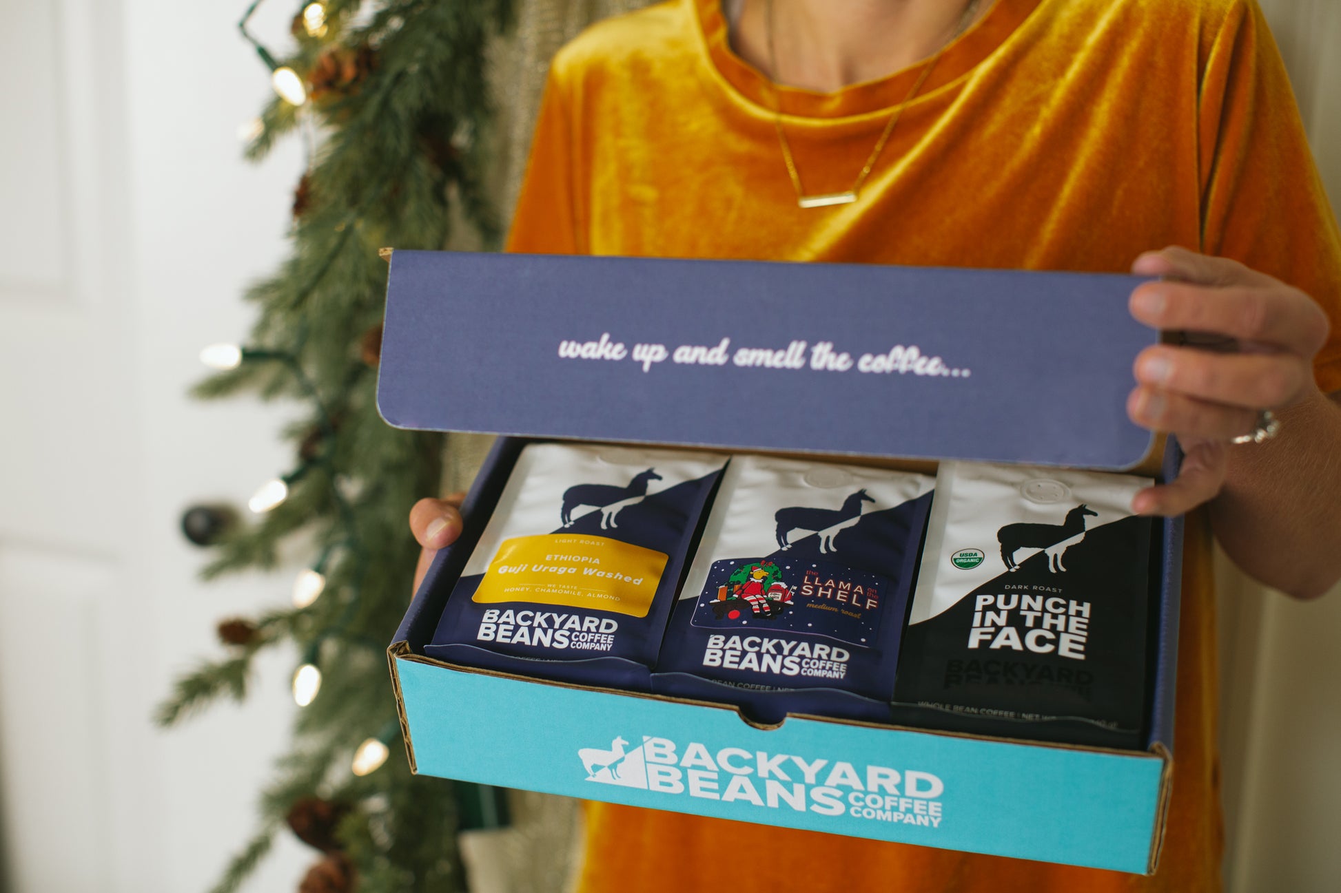 Image of woman's hands opening gift box.