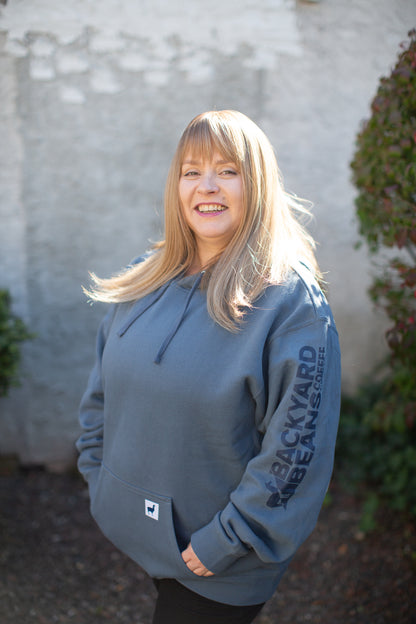 Image of woman smiling wearing Backyard Beans Coffee Co. Hoodie