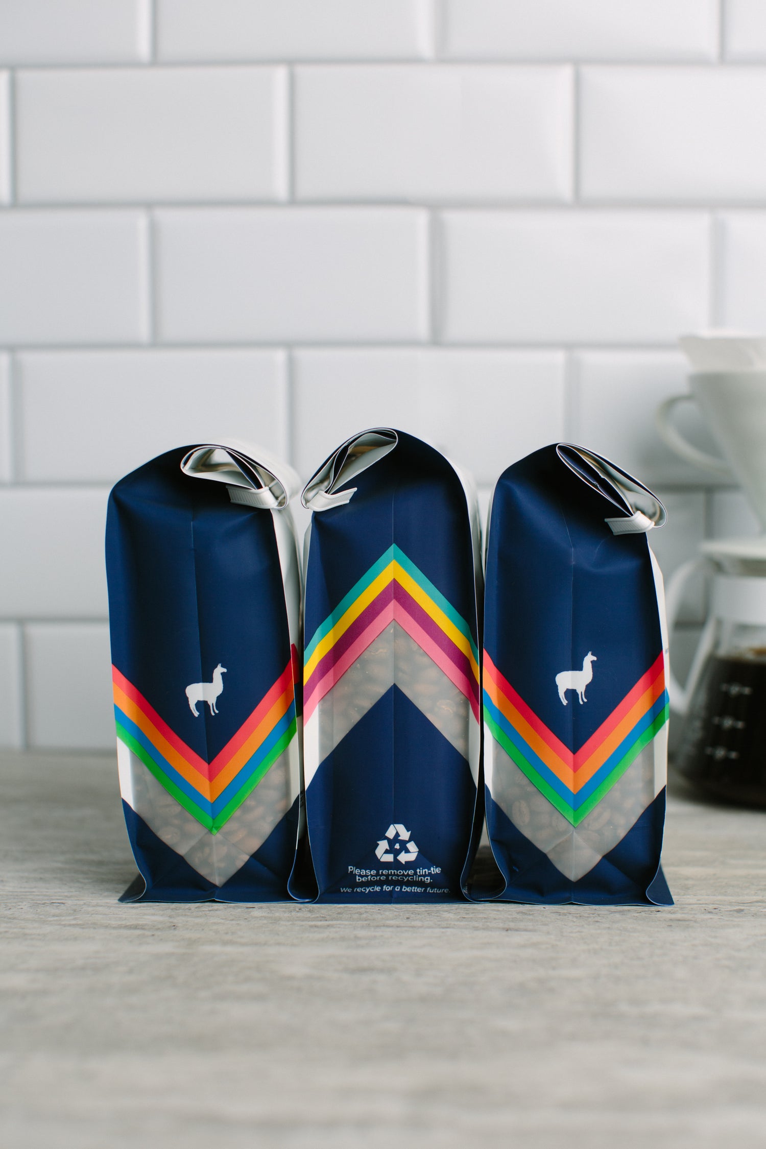 Image of three coffee bags in kitchen.