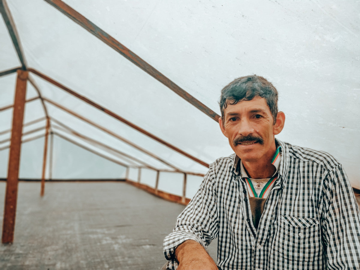 image of farmer Audon Solano in his drying patio