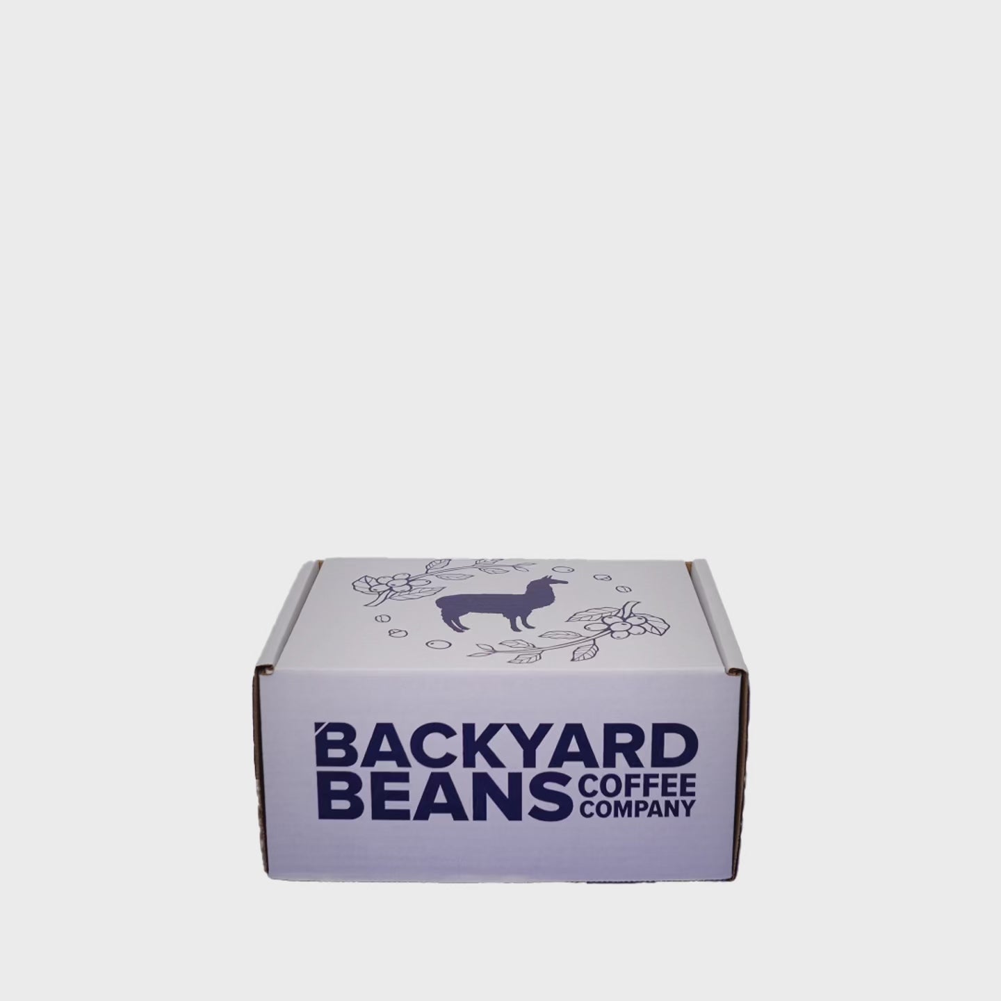 short stop motion video showing the backyard beans gift box including 2 retail 12oz coffee bags and backyard beans branded mug